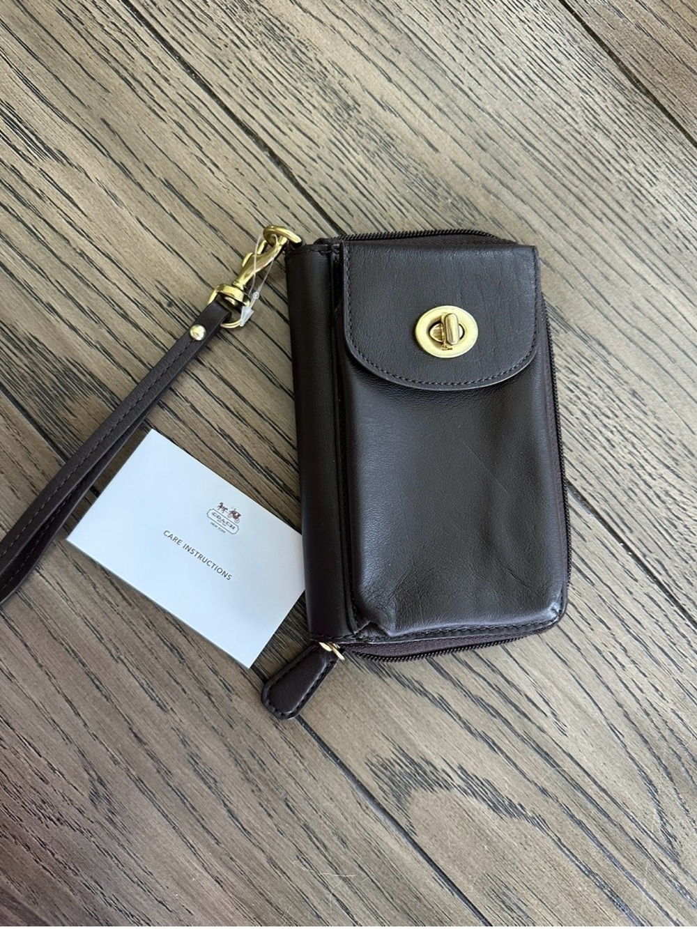 Coach Dark Brown Leather Wristlet Phone Case with Gold Turnlock